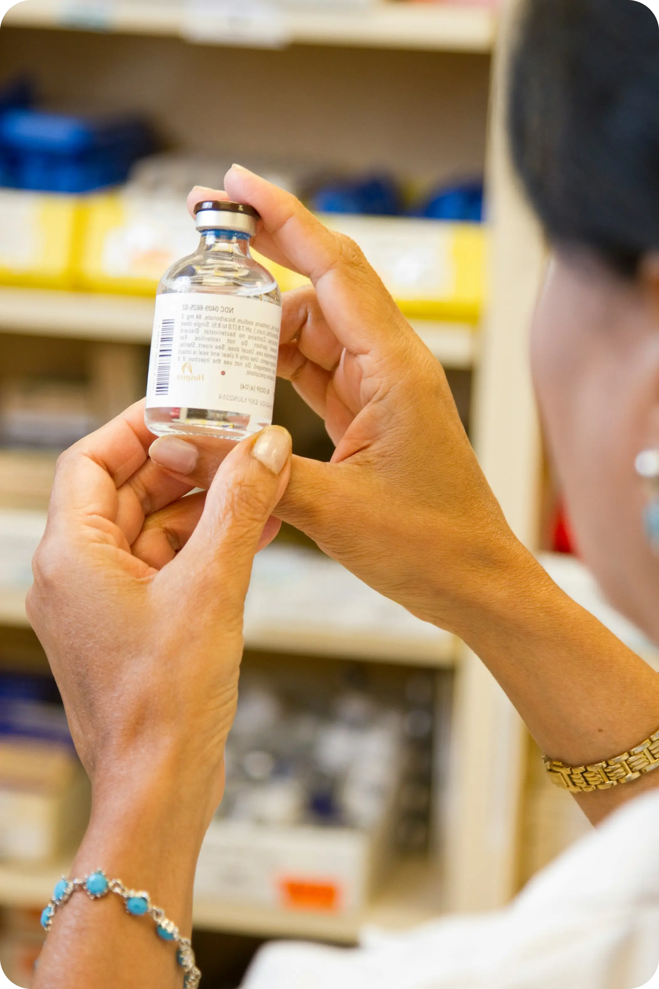 Pharmacist preparing compounded peptide medications